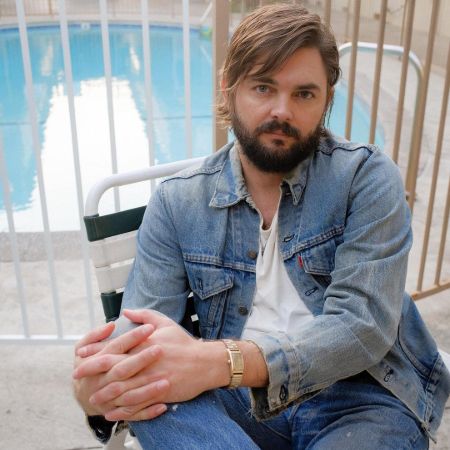 Nick Thune is posing for the photo.